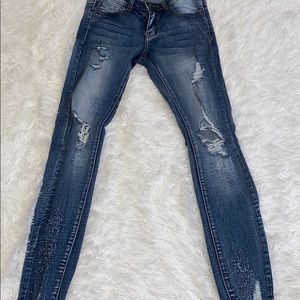 Light wash distressed skinny jeans